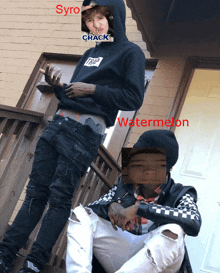 two young men sitting on a porch with one wearing a hoodie that says trap