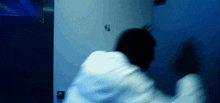 a blurry picture of a person in a bathroom with a sign on the wall that says ' female '