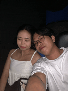 a man and a woman are sitting next to each other