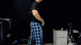 a man is dancing in front of a chair that says a2