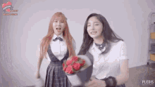 a girl holding a bouquet of red roses next to another girl with a pledis logo on the bottom