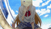 a girl in a school uniform is sitting on a man 's lap with a blue sky behind her