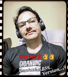 a man wearing headphones and a t-shirt that says gioanung sanhitha bss version