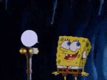 spongebob squarepants is standing next to a microphone and holding a light .