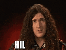 a man with long curly hair has the word hilarious on his face