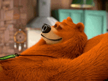 a stuffed animal bear is laying down with his eyes closed