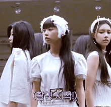 a girl with long black hair is wearing a white shirt with the number 7 on the front