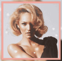 a close up of a woman 's face with hearts in the background
