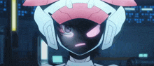 a close up of a robot 's face with pink eyes