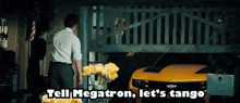 a man standing in front of a fence with the words tell megatron let 's tango