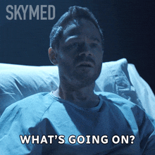 a man in a hospital bed with the words what 's going on