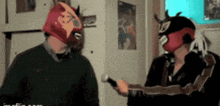 a man in a mask is talking to another man