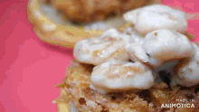 a close up of a donut with white frosting on it
