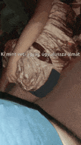 a woman in a dress is laying on a bed with the words ki mint veti agyat ugyanalussza almat