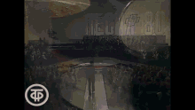 a crowd of people watching a show with the word techa 80 on the wall