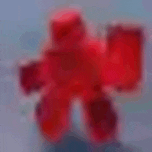 a blurred image of a red gummy bear on a table .