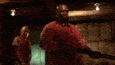 a man in a red shirt says i 'm pretty fucking far from okay .