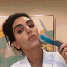 Using A Roller On My Face Dr Azadeh Shirazi GIF - Using A Roller On My Face Dr Azadeh Shirazi Skincare By Dr Azi GIFs