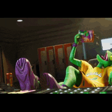a green lizard wearing a yellow shirt that says chuck is eating a bag of chips
