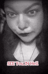 a black and white photo of a woman with the words see you in hell on the bottom