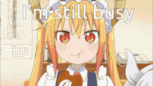 a girl with horns is eating a piece of food with the words " i 'm still busy " behind her
