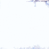 a man in a white shirt is standing in front of a building with feathers falling from the ceiling .