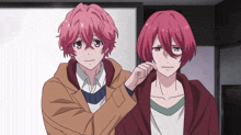 two anime characters one with pink hair and one with red hair