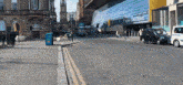 a busy city street with a building that says ' central street '