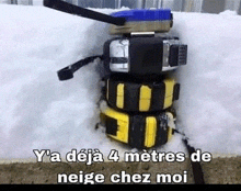 several tape measures are stacked on top of each other in the snow with the caption y 'a deja 4 metres de neige