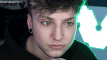 a close up of a person 's face with the username @lestrangecheryl on the bottom
