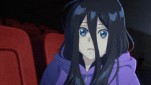 a girl with long black hair is wearing a purple sweatshirt