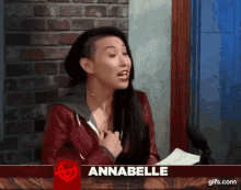 a woman with the name annabelle on a red sign