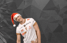 a man wearing a santa hat is wearing a shirt that says plus