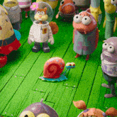a group of cartoon characters including spongebob and sandy cheeks are standing on a green wooden floor