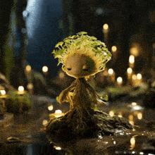 a doll with roots and leaves on its head