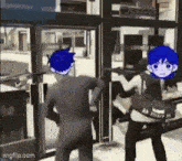 a couple of people are standing in front of a door .