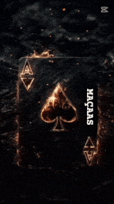 a man smoking a cigarette next to a burning ace of spades playing card