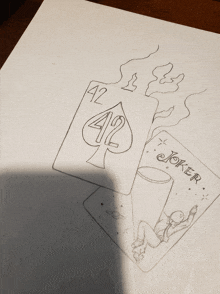 a drawing of two playing cards with the number 42 and the word joker