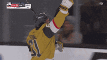 a hockey player in a yellow jersey with the number 51 on it