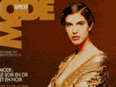 a woman in a gold dress is on the cover of a magazine called mode