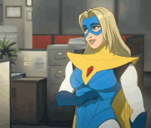 a cartoon woman in a blue and yellow superhero costume is standing in a room .