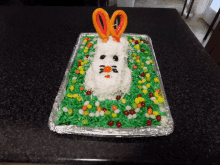 a cake that looks like a bunny made out of candy on a table
