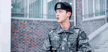 a man in a military uniform has the letters adts on his uniform
