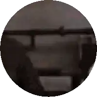 a circle with a blurred image of a person 's face in the middle