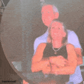 a blurry picture of a man and a woman with the words trashtvtroll on the bottom