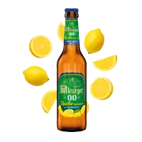 a bottle of bitburger surrounded by lemons on a white background