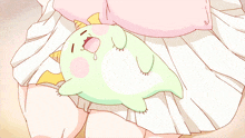 a cartoon character is laying on a woman 's lap with its mouth open