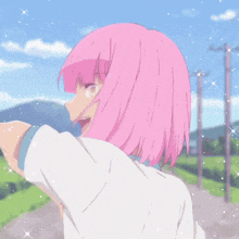 a girl with pink hair and a white shirt is walking down a road
