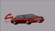 a robot is smashing a red car with a yellow explosion .