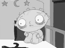 a cartoon character is sitting on a bed with a hanger on the floor